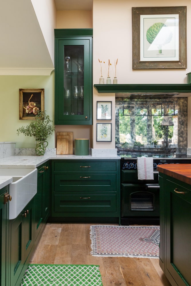 A dark green traditional kitchen