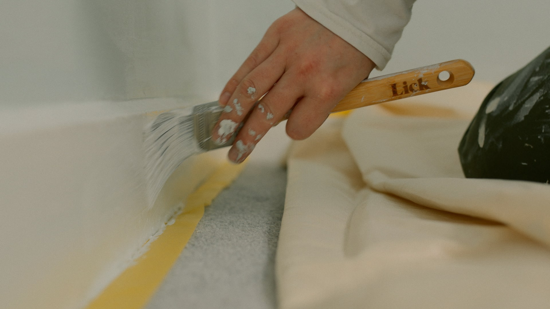 Lick masking painters tape being used to protect floors