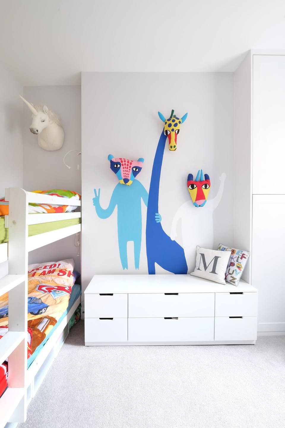 Kids bedroom DIY blue animal mural with white minimal furniture