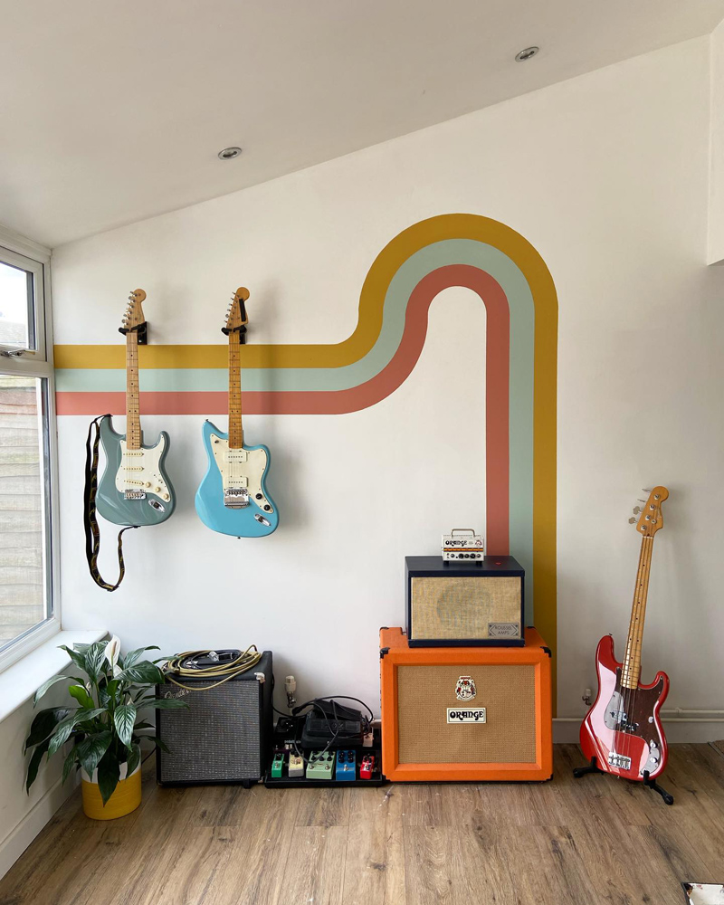 70s retro mural with guitars on wall 