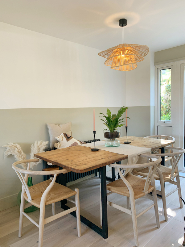 Modern dining room with feature wall painted Lick paint Griege 02 creating a faux dado rail effect
